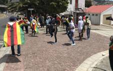 A handful of Zimbabwean nationals have gathered at the country's embassy in Cape Town to celebrate the leadership change in the country. Picture: Kevin Brandt/EWN.