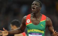 Grenada's Kirani James celebrates after winning the men's 400m final at the athletics event of the London 2012 Olympic Games on August 6, 2012 in London. Picture: AFP.