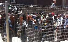 FILE: Asylum seekers waiting in long queues at the Home Affairs office in Cape Town. Picture: EWN.
