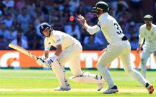 England batsman Joe Root (L) steers a ball to Australia's Marnus Labuschange (C) on the third day of the second Ashes cricket Test match in Adelaide on 18 December 2021. Picture: AFP