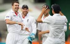England's James Anderson (L) celebrates with team mates captain Alastair Cook (R) Nick Compton and keeper Matt Prior. Picture: AFP