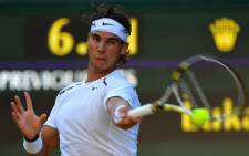 Spain's Rafael Nadal plays a forehand shot during his second round men's singles match against Czech Republic's Lukas Rosol at the 2012 Wimbledon Championships on 28 June, 2012. Picture: AFP