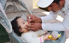 FILE: A health worker gives a young child the polio vaccine. Picture: @WHO/Twitter