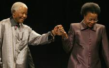 FILE: Former president Nelson Mandela is helped by his wife Graca Machel. Picture: Werner Beukes/SAPA