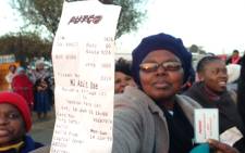 A bus commuter holds up her Putco bus ticket in Mamelodi, Wednesday 1 July 2015. Picture: Vumani Mkhize/EWN. 