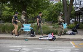 Law enforcement works the scene after a mass shooting at a Fourth of July parade on 4 July 2022 in Highland Park, Illinois. Reports indicate at least six people were killed and more than 20 injured in the shooting. Picture: Jim Vondruska/Getty Images/AFP