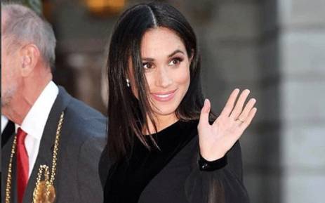 'Down to earth' Meghan closes her own vehicle door