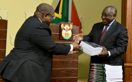 Chief Justice Raymond Zondo hands President Cyril Ramaphosa the final part of his report into state capture on Wednesday, 22 June 2022. Picture: GCIS