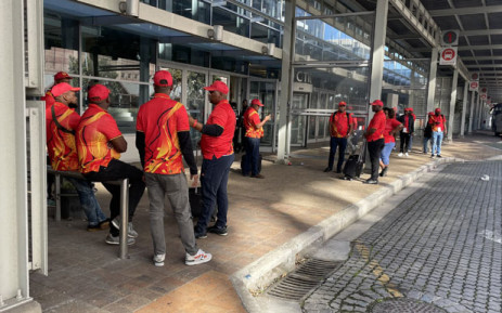 Numsa members wait outside the Cape Town International Convention Centre on 25 July 2022 following the labour court’s halting of the union’s congress. Picture: Theto Mahlakoana/Eyewitness News