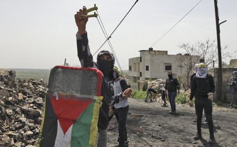 Palestinians demonstrating against the expropriation of land by Israel, clash with Israeli security forces in the village of Kfar Qaddum near the Jewish settlement of Kedumim in the occupied West Bank on 1 April 2022.