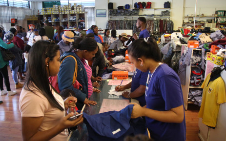 FILE: Parents get school uniforms for their children ahead of the start of the new school year. Picture: Bertram Malgas/Eyewitness News