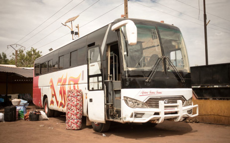 Luggage belonging to a passenger lies next to a parked bus whilst waiting for cross-border transport to resume in Bamako on 11 January 2022. Picture: FLORENT VERGNES / AFP