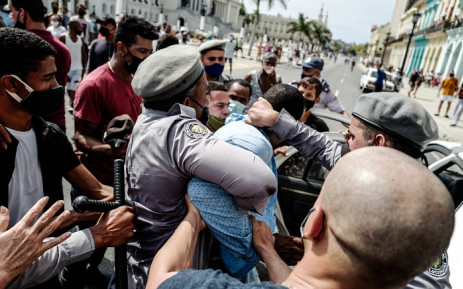 FILE: In this file photo taken on 11 July 2021 a man is arrested during a demonstration against the government of Cuban President Miguel Diaz-Canel in Havana. Picture: Adalberto Roque / AFP.