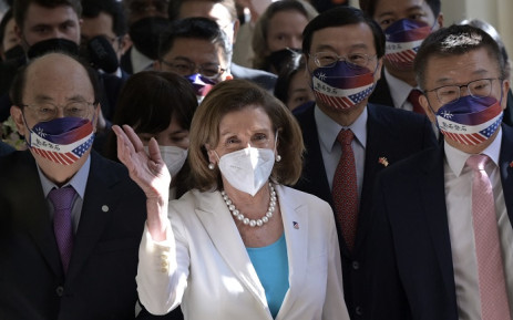 Visiting US House Speaker Nancy Pelosi (C) waves to journalists during her arrival at the Parliament in Taipei on August 3, 2022. Picture: Sam Yeh / AFP. 