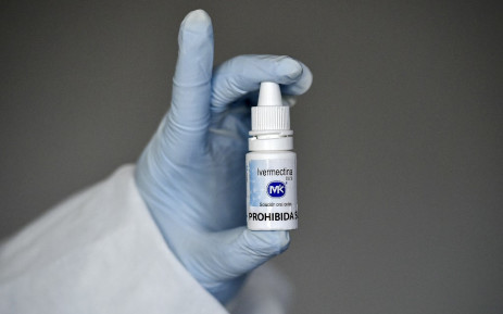 A health worker shows a bottle of Ivermectin. Picture: AFP. 