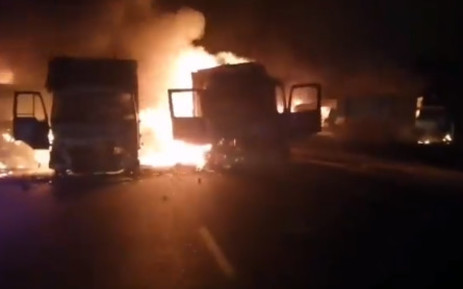 A screengrab of a video showing trucks set alight during protests in KwaZulu-Natal on 9 July 2021 calling for the release of former President Jacob Zuma from jail.