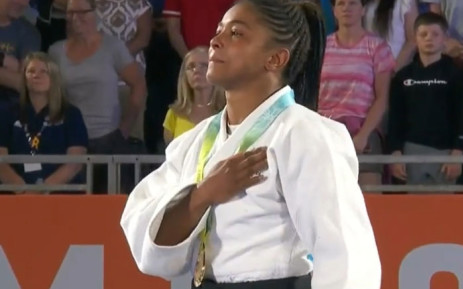 Michael Witbooi of South Africa listens to the national anthem after winning the gold medal in the women's 48kg judo final at the Commonwealth Games in Birmingham on 1 August 2022. Picture: @TeamSA2024/Twitter