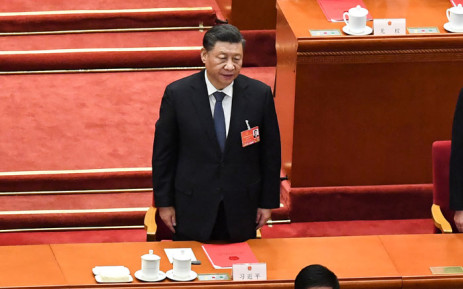 FILE: China's President Xi Jinping sings the national anthem during the closing session of the National People’s Congress (NPC) at the Great Hall of the People in Beijing on 11 March 2022. Picture: Leo RAMIREZ/AFP
