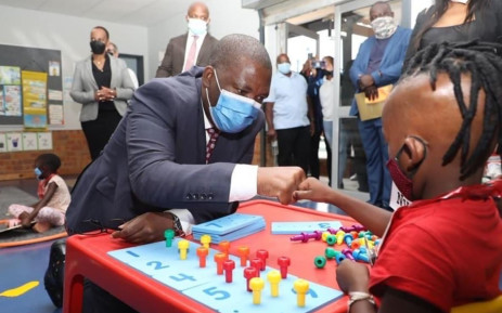 Gauteng Education MEC Panyaza Lesufi interacts with a child on 12 January 2022, the first day of the 2022 academic year. Picture: @Lesufi/Twitter