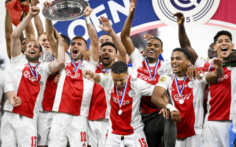 (L to R) Daley Blind, Dusan Tadic, Noussair Mazraoui, Devyne Rensch, Jurrien Timber and Edson Alvarez celebrate after winning the national championship at the end of the Dutch Eredivisie match between Ajax Amsterdam and SC Heerenveen at the Johan Cruijff Arena on 11 May 2022 in Amsterdam Picture: Olaf Kraak/ANP/AFP