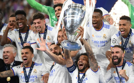 Real Madrid's Brazilian defender Marcelo (C) lifts the The Champions League trophy after Madrid's victory in the UEFA Champions League final football match between Liverpool and Real Madrid on 28 May 2022.