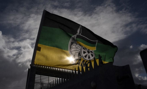 An ANC flag flies outside a polling station in Langa, near Cape Town.