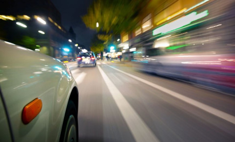 Car on road speeding blurred motion 123rf
