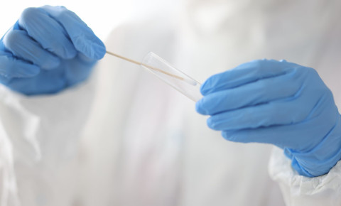 Doctor test tube cotton swab medical gloves PCR test lab laboratory Covid 123rf 
