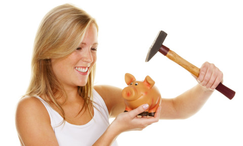 woman breaking piggy bank 123rf