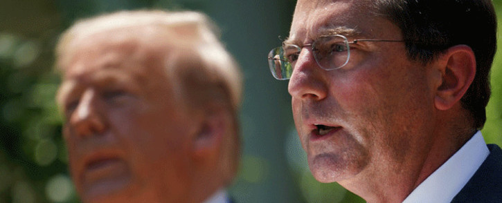 In this file photo taken on 15 May 2020 shows US Secretary of Health and Human Services Alex Azar (R) speaking in the Rose Garden of the White House in Washington, DC as US President Donald Trump (L) looks on. Picture: AFP