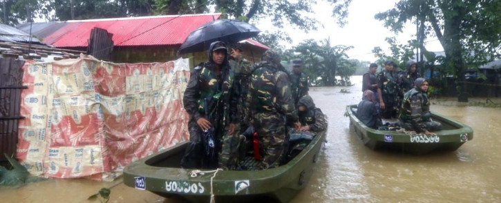 Bangladesh army personnel evacuate affected people from a flooded area following heavy monsoon rainfalls in Sylhet on 18 June 2022. 