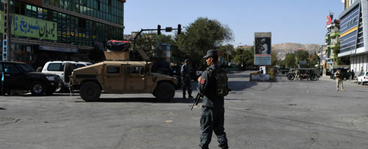 FILE: Afghan security personnel stand guard near the site of a suicide attack in Kabul on 25 August 2017. Picture: AFP