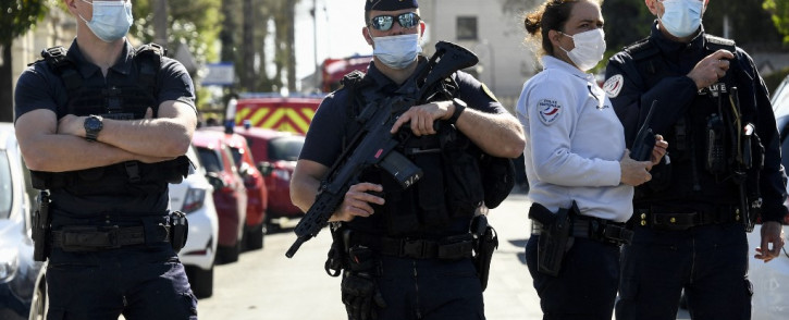 FILE: French police officials block off a street near the police station in Rambouillet, south-west of Paris, on April 23, 2021, after a woman was stabbed to death. Picture: AFP