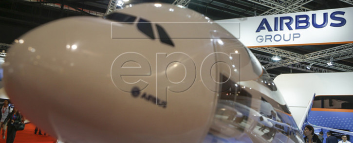 The model of an Airbus A380 pictured against the company logo on display in the exhibition hall of the Singapore Airshow, 16 February 2016. The fifth edition of the biennial Singapore Airshow will run from 16-21 February 2016 at the Changi Exhibition Centre and showcases over a 1000 aviation and defence exhibitors from 50 different countries. Picture: EPA/WALLACE WOON.