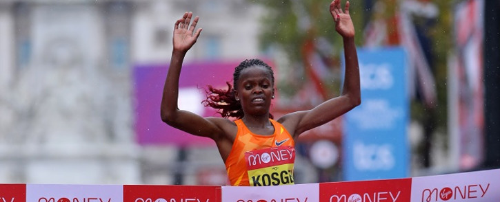 Kenya's Brigid Kosgei runs to the finish line to win the women's race of the 2020 London Marathon in central London on 4 October 2020. Picture: AFP.
