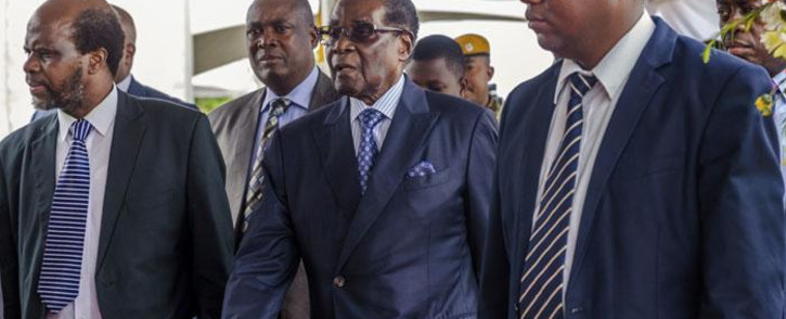FILE: Zimbabwe's former President Robert Mugabe (centre) arrives for a graduation ceremony at the Zimbabwe Open University in Harare on 17 November 2017. Picture: AFP
