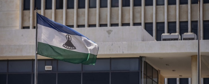 FILE: A picture taken in Maseru, on 31 January 2020 shows the flag of Lesotho outside the Parliament building. Picture: AFP.