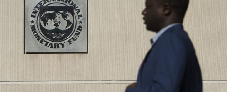 FILE: A man walks past the International Monetary Fund (IMF) headquarters in Washington DC on 5 September, 2018. Picture: AFP