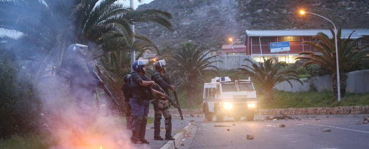 FILE: Public order police monitor the situation in Hangberg after residents protested over fishing quotas. Photo: Bertram Malgas/EWN
