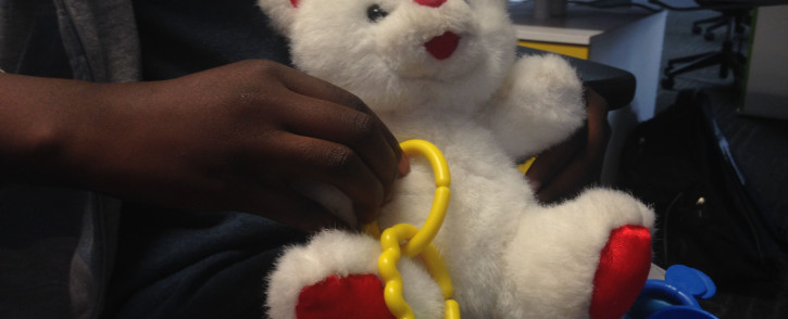 FILE. An 11 year-old girl holds her favourite toy, she was allegedly raped by the owner of a daycare centre. Picture: Vumani Mkhize/EWN.