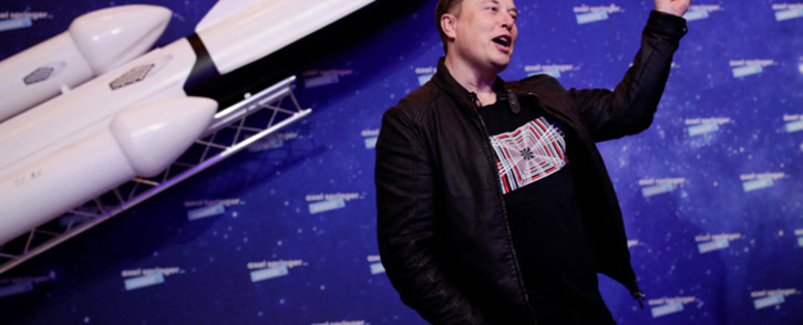SpaceX owner and Tesla CEO Elon Musk gestures as he arrives on the red carpet for the Axel Springer Awards ceremony, in Berlin, on 1 December 2020. Picture: HANNIBAL HANSCHKE/POOL/AFP