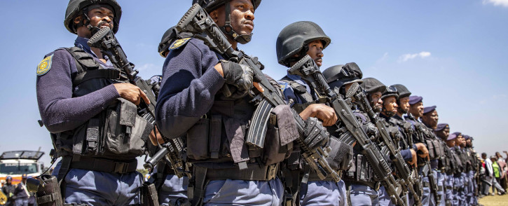 Members of the Tactical Response Team and National Intervention Unit prepare for deployment into the Westbury area. The team is tasked with addressing gang and drug-related crimes that have plagued the community here for years. Picture: Thomas Holder/EWN.