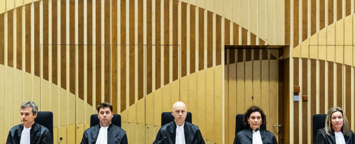 FILE: Magistrates wait, on 9 March 2020 in Schiphol, before the opening of the trial of four men accused of murder over the downing of Malaysia Airlines flight MH17 in 2014, even though the suspects are still at large. Picture: AFP