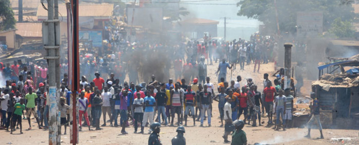 FILE: Protesters clash with anti-riot police in a street in Conakry, Guinea on 13 March 13, 2018 during a demonstration against President Alpha Conde. Picture: AFP