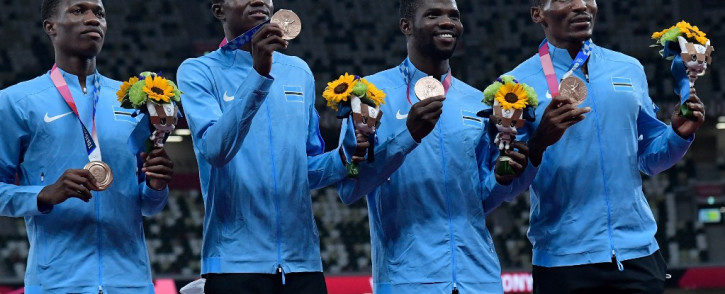 Botswana's bronze medallists (from left)  Bayapo Ndori, Zibane Ngozi, Baboloki Thebe and Isaac Makwala pose during the victory ceremony for the men's 4x400m relay event at the Tokyo 2020 Olympic Games at the Olympic Stadium in Tokyo on 7 August 2021. Picture: Javier Soriano/AFP