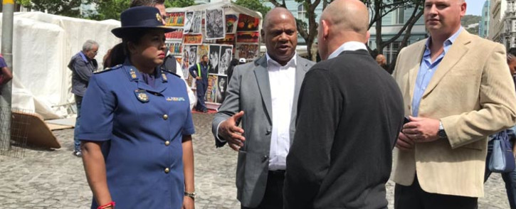 Cape Town Mayor Dan Plato and Cape Town Central Police Station commander Brigadier Hansia Hansraj speak with business owners at Green Market Square during a walkabout in the City Centre. Picture: Kevin Brandt/EWN