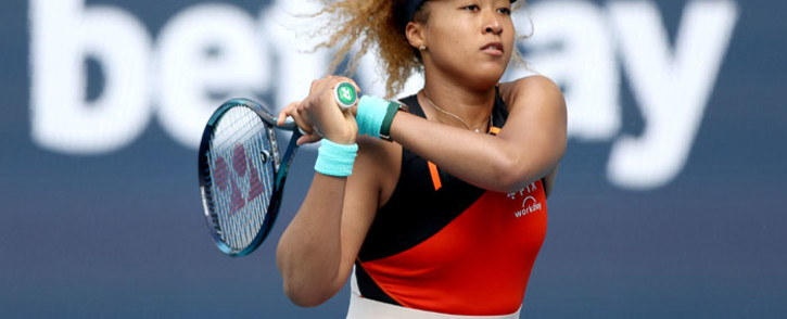 Naomi Osaka of Japan returns a shot to Belinda Bencic of Switzerland during the women's semifinals of the Miami Open at Hard Rock Stadium on 31 March 2022 in Miami Gardens, Florida. Picture: Matthew Stockman/Getty Images/AFP