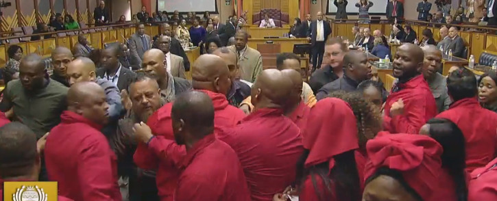 FILE: EFF MPs are thrown out during Pravin Gordhan's budget vote in July 2019. Picture: Parliament YouTube.