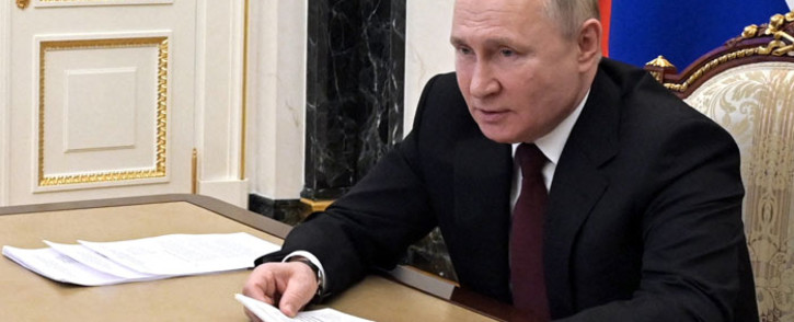Russian President Vladimir Putin chairs a meeting with members of Russian paralympic teams ahead of Beijing 2022 Winter Paralympic Games via a teleconference call, in Moscow on 21 February 2022. Picture: Alexey NIKOLSKY/Sputnik/AFP