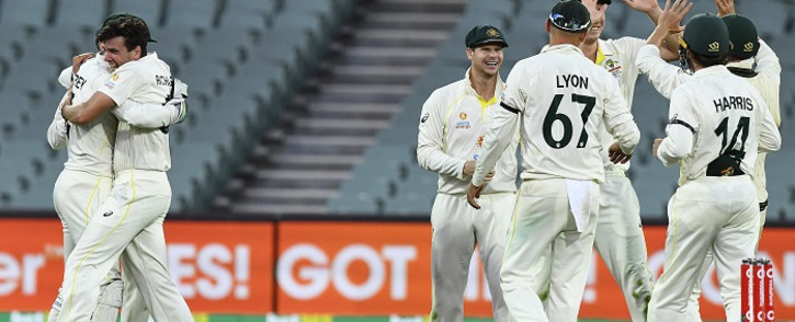 Australian players celebrate victory against England in the second cricket Test match of the Ashes series at Adelaide Oval on December 20, 2021, in Adelaide. Picture: William West / AFP.
